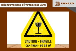 Biểu tượng hàng dễ vỡ tam giác vàng – cảnh báo nguy hiểm chuẩn quốc tế.